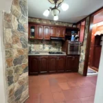 Cocina integral en madera de Casa 22