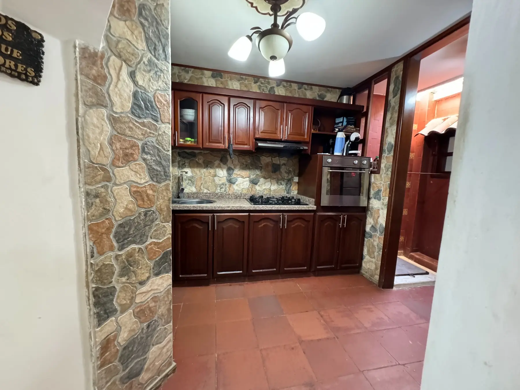 Cocina integral en madera de Casa 22